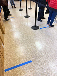 Stores use tape to encourage social distancing